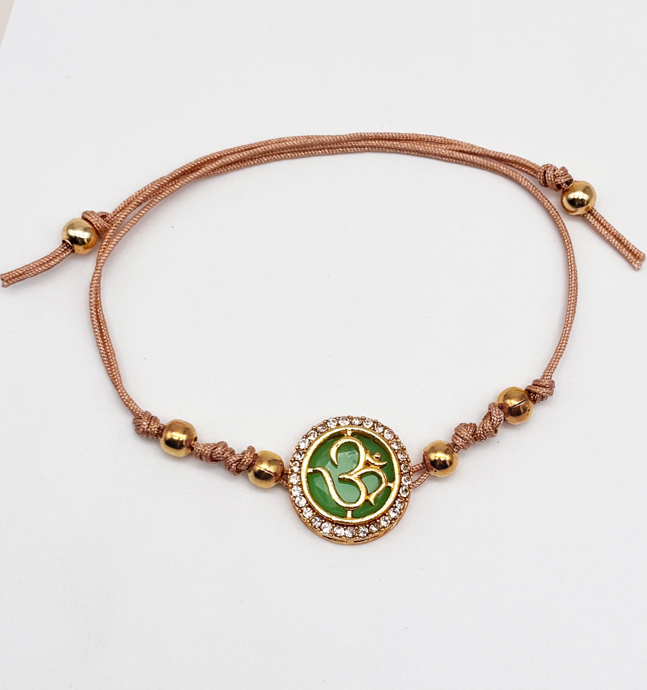 Om & Crystals Studded Rakhis (Light Green)